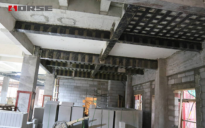 Slab, column, beam strengthening with CFRP wrapping