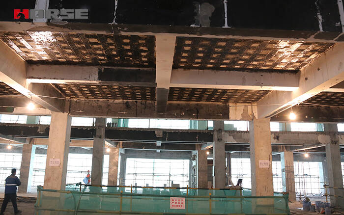 Slab, column, beam strengthening with CFRP wrapping