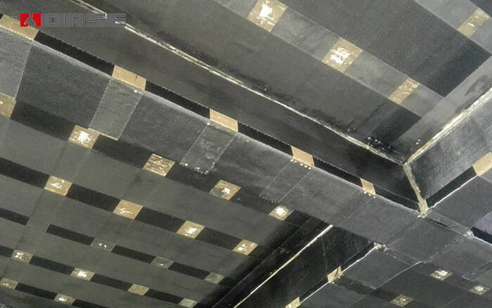 Carbon fiber retrofitting of concrete beams and slabs
