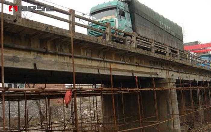 Prestressed CFRP laminate for reinforced bridge