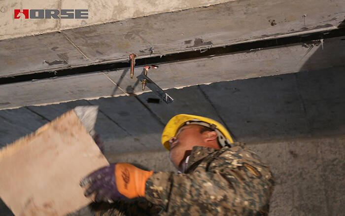 Strengthening by prestressed CFRP plate