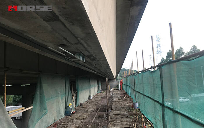 HM Prestressed CFRP laminate strengthening the concrete bridge