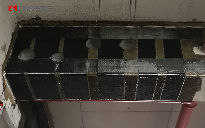 Concrete beams strengthening by CFRP composite strengthening system