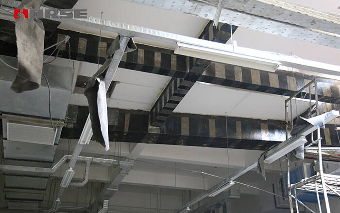 Structural seismic strengthening by carbon fiber fabric