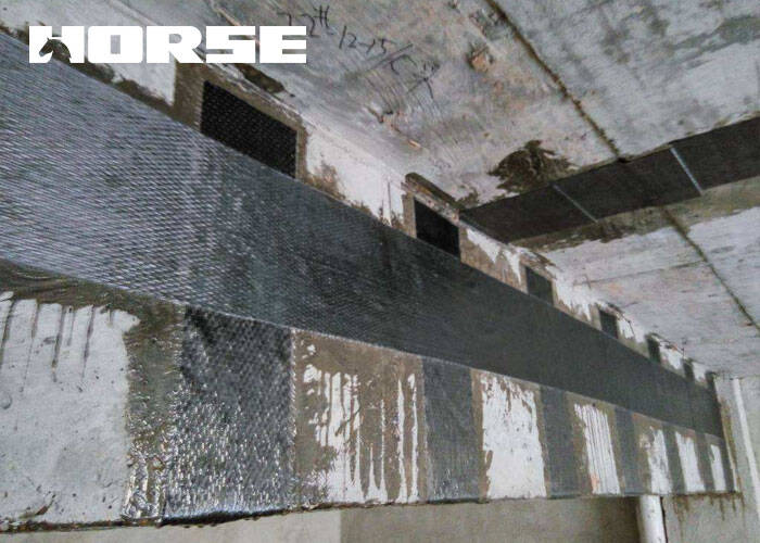 Repair of reinforced concrete beams using carbon fiber reinforced polymer