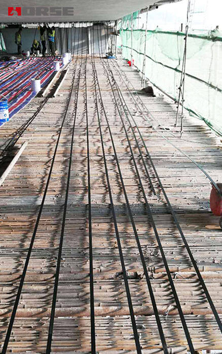 Concrete Bridge Beams Rehabilitation with Prestressed  CFRP Systems