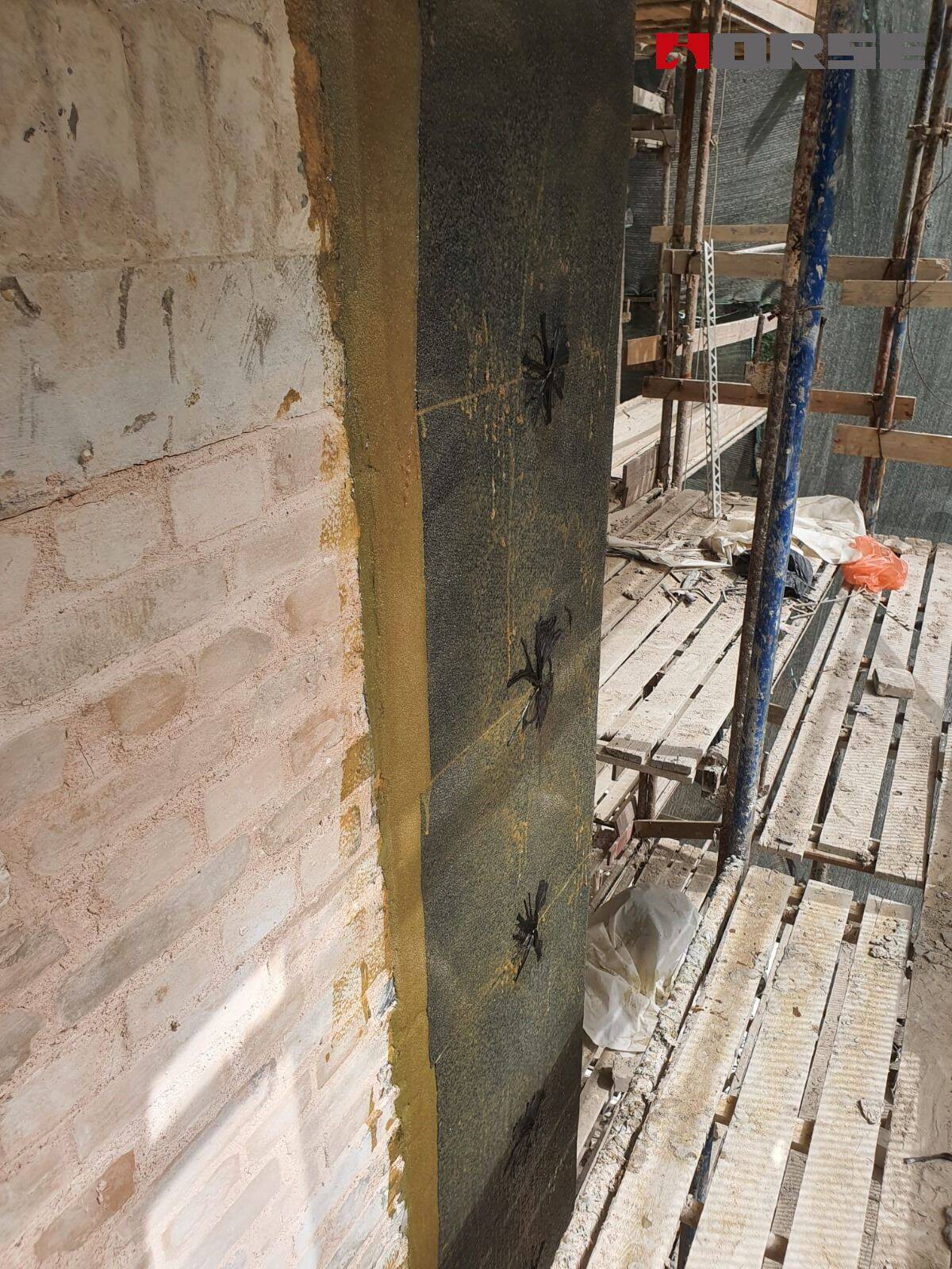 Wall Structural Retrofitting with CFRP And Carbon Fiber Anchor