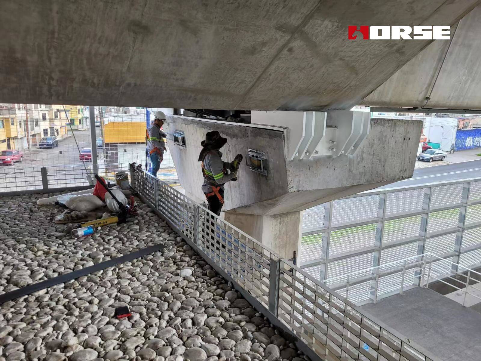 Strengthening of Bridge Structures with post tensioned CFRP plates