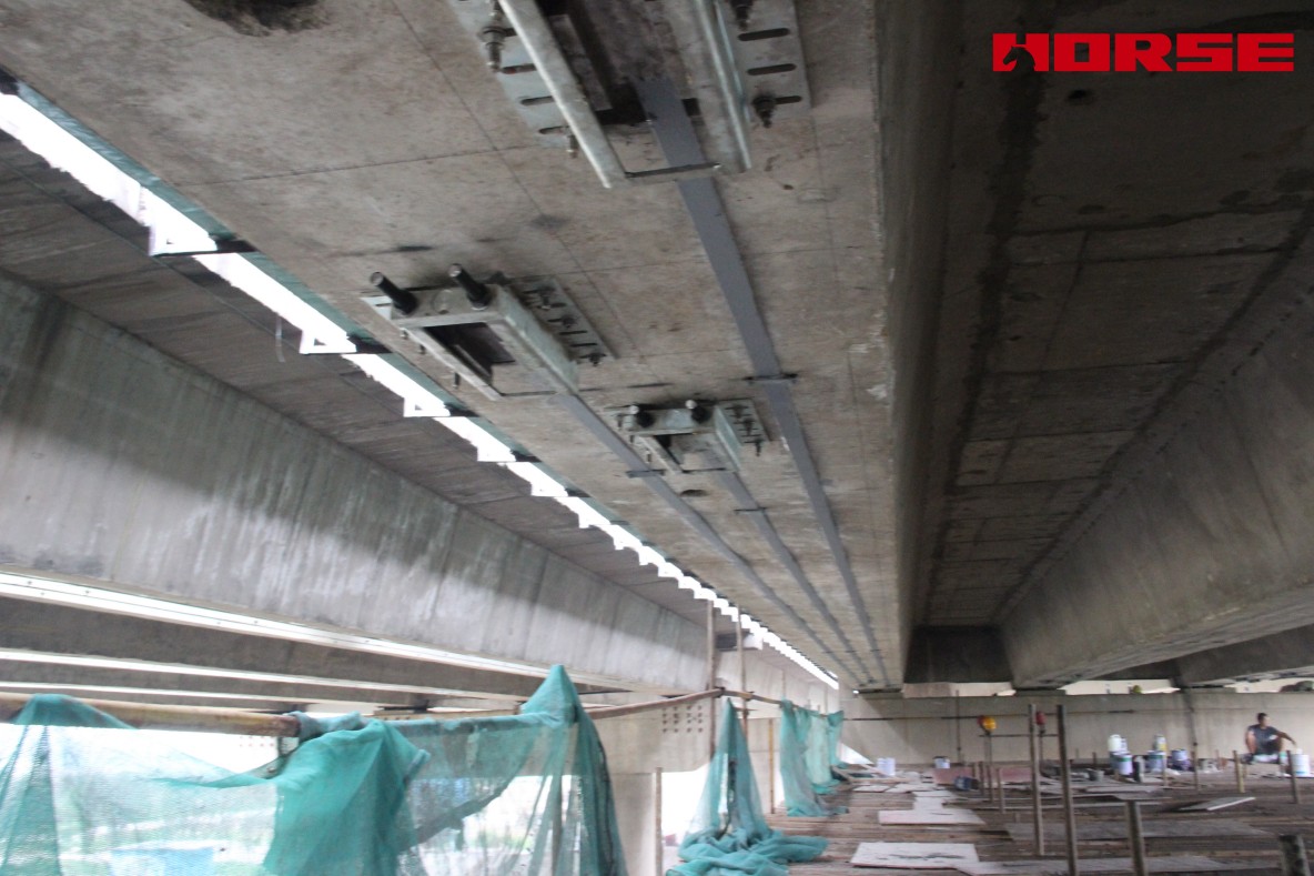 Pre-stress Carbon Fiber Laminates "Lock" Concrete Cracks