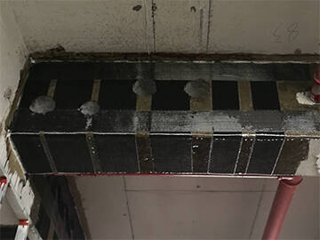 Concrete beams strengthening by CFRP composite strengthening system