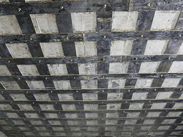 Reinforcement of slab by adhesively sticking steel plate