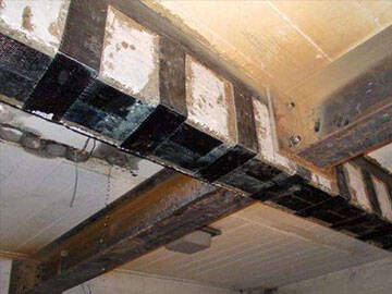 Application of H-shaped beam and CFRP wrap in strengthening of a building