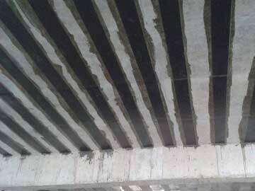 Building floor reinforcement with high strength carbon fiber reinforced polymer